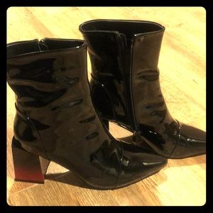 Black faux patent leather pointed toe boots